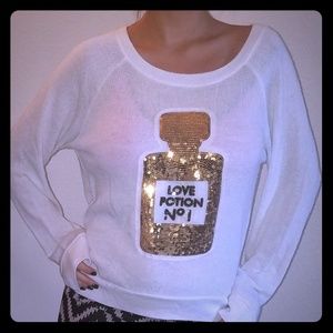 Sweater with shiny application